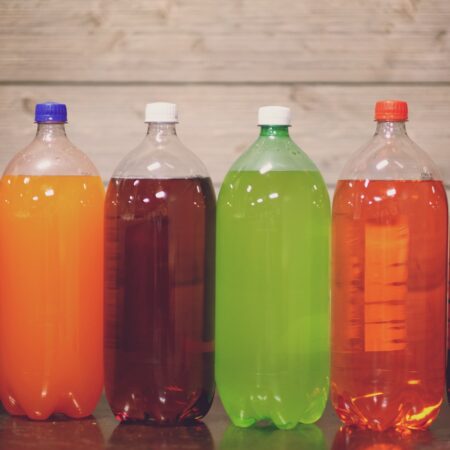 six plastic bottles with assorted-color liquid